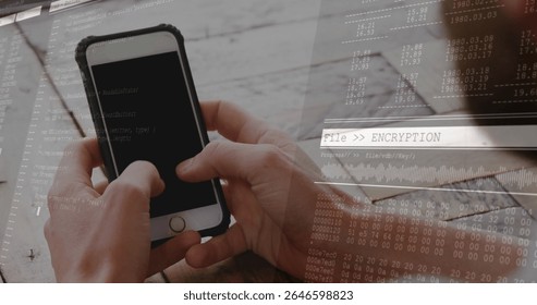 Holding hands showing rugged smartphone over wooden desk, with laptop notebook, encryption overlay. Technology, cybersecurity, programming, data, innovation, workspace, security