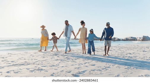 Holding hands, walking and big family at the beach on vacation, adventure or holiday together. Love, travel and children with parents and grandparents on the sand by the ocean or sea on weekend trip. - Powered by Shutterstock