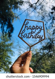 Holding Happy Birthday Sign As Background 