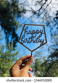 Holding Happy Birthday Sign As Background 