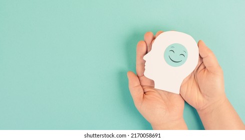 Holding A Head With A Smiling Face In The Hands,mental Health Concept, Positive Mindset, Support And Evaluation Symbol