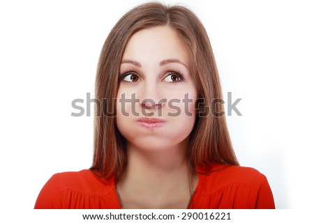 Holding Her Breath - This is a shot of a woman making a funny face with puffy cheeks while holding her breath.