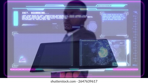 Holding laptop, male wearing suit and tie examining holographic panels in office, viewing code. Futuristic, technology, innovation, data visualization, digital interface, professional, modern