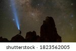 Holding a light up to the Milky Way at the Trona Pinnacles.