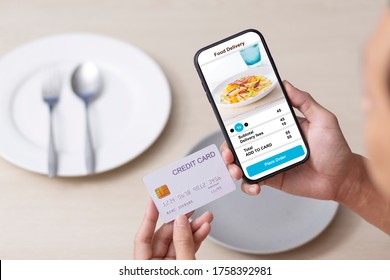 Holding Phone With Application And Credit Card Delivery Food Online