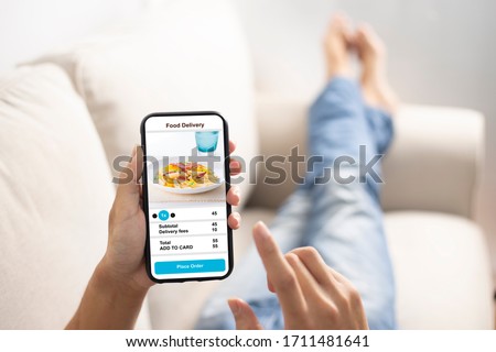 holding phone with application delivery food online Stock foto © 