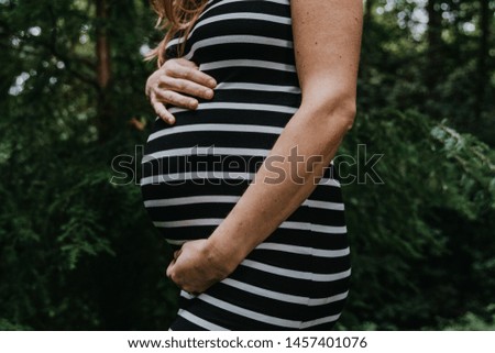 Similar – Foto Bild Schwangere Frau, die ihren Bauch streichelt.