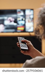 Holding Remote Control While Watching Television