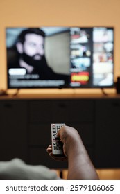Holding Remote Control While Watching Television