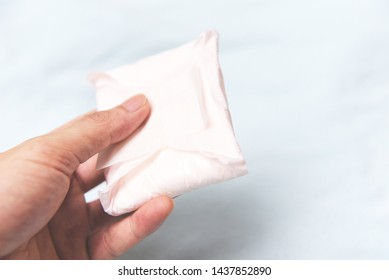 Holding Sanitary Napkin Or Feminine Sanitary Pad On Hand / Female Hygiene Means Women Period Product Absorbent Sheets