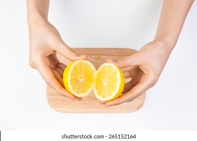Holding Sliced Lemon 