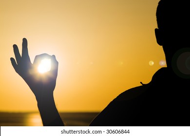 Holding the Sun - Shutterstock ID 30606844