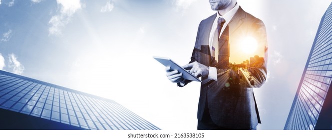 Holding Tablet Business. Businessman Analyzing Economic Growth Graph Chart And Data Sales On Double Exposure. Digital Marketing Technology Banner