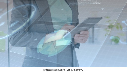 Holding tablet, executive in gray suit using holographic UI in office with grid charts plus icons. Technology, innovation, futurism, business, data visualization, digital interface, professional - Powered by Shutterstock - Get 15% off with code: PIKWIZARD15