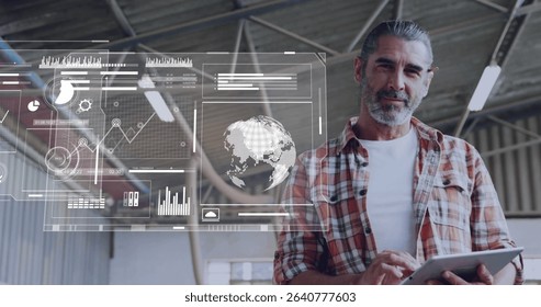 Holding tablet, technician in plaid shirt monitoring holographic charts inside workshop, copy space. Industrial, technology, analysis, data, engineering, futuristic, workspace