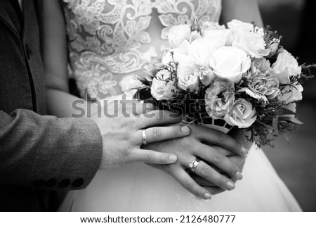 Holding wedding rings. Noble metal jewellery for married couples.Wedding ceremony and planing.Holding traditional bridal commitment jewellery.Golden ring for bride and groom.Marriage proposal exchange Photo stock © 
