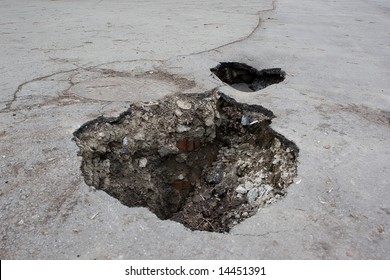 Hole In Asphalt Road