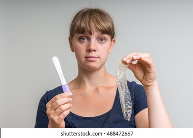 Hole in condom and positive pregnancy test - pregnant woman don't understand what happened