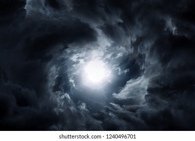 Hole in the Dark and Dramatic Storm Clouds - Shutterstock ID 1240496701