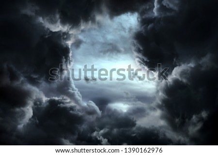 Hole in the Dark and Dramatic Storm Clouds