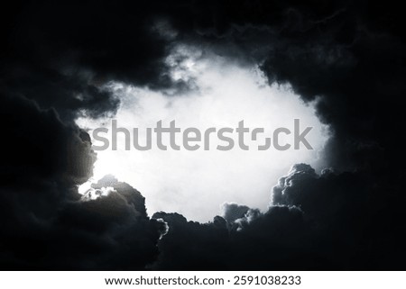 Hole in the Dark and Dramatic Storm Clouds