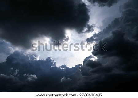 Hole in the Dark and Dramatic Storm Clouds