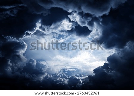 Hole in the Dark and Dramatic Storm Clouds
