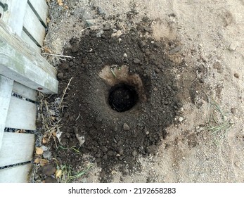 A Hole Dug In Soil By An Auger