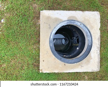 A Hole Of Grease Trap With The Drain System Around The House.