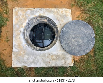 A Hole Of Grease Trap Underground Tank With The Drain System Around The House.