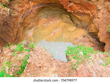 Hole In Ground Which Has Water With Copy Space Add Text