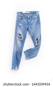 Hole On Blue Jeans ,Blue  Ripped Jeans Isolated On The White Background


