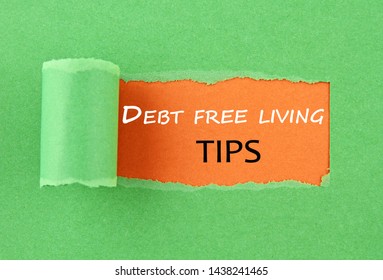 Hole In The Paper With The Text Debt Free Living Tips