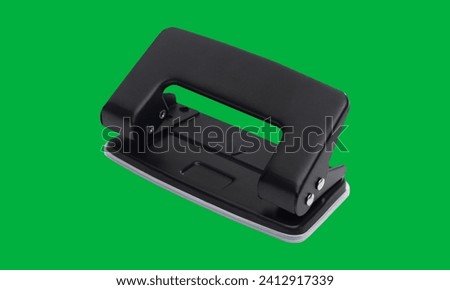 Hole puncher on green screen 