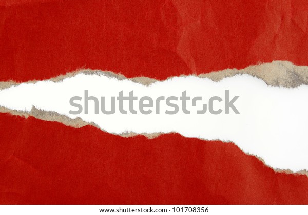 Hole ripped in\
red paper on plain\
background
