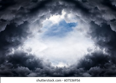 Hole of the Sky in the Dark Storm Clouds - Shutterstock ID 607536956