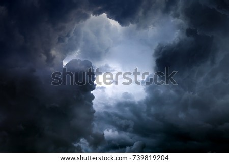 Hole of the Sky in the Dark Storm Clouds