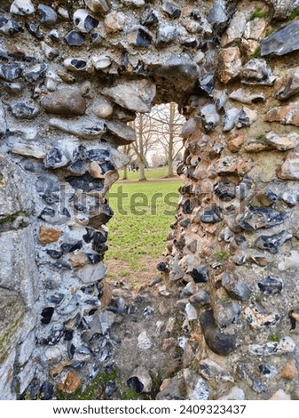 Hole is a stone wall of a medievil castle ruin