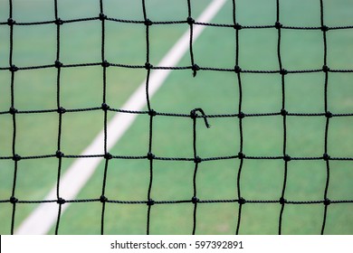 A Hole In A Tennis Net