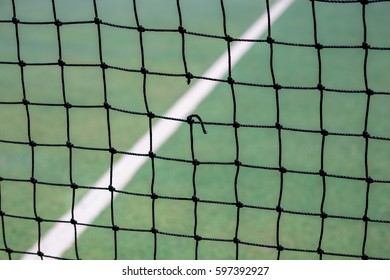 A Hole In A Tennis Net