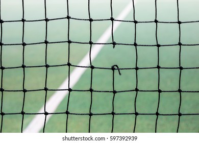 A Hole In A Tennis Net