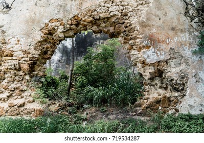 Hole In The Wall Of Abandoned Stone Building. 