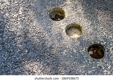 Holes in asphalt pavement, drilled cylindrical specimen for laboratory testing