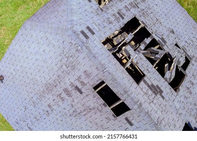 Holes In Roof Shingles Tiled On Home From Damaged Roofing An Aerial View