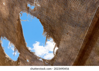 Holes In The Torn Fabric Awning For Protection From The Sun During Camping