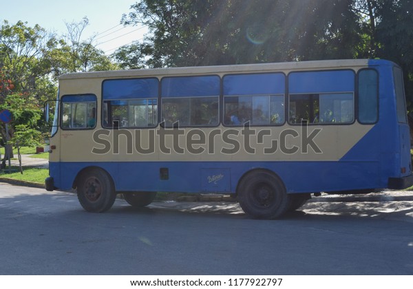 HOLGUIN, CUBA - SEPTEMBER 10 2018: Old Cuban bus on\
the road