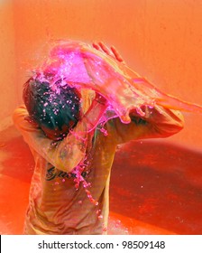 Holi Celebrations - Splash Of Colorful Water On Holi Festival.