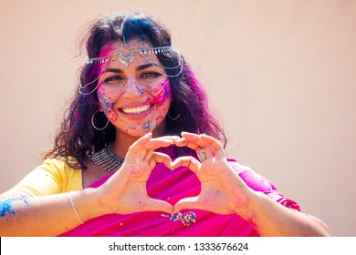 Holi Festival Of Colours. Portrait Of Happy Indian Girl In Traditional Hindu Sari On Holi Color . India Woman Silver Jewelry With Powder Paint On Dress ,colorful Pink And Blue Hair In Goa Kerala