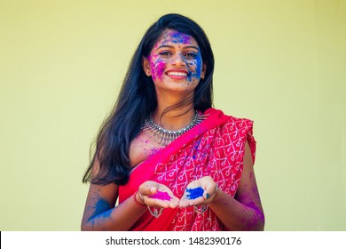 Holi Festival Of Colours. Portrait Of Happy Indian Girl In Traditional Hindu Sari On Holi Color . India Woman Silver Jewelry With Powder Paint On Dress ,colorful Pink And Blue Hair In Goa Kerala