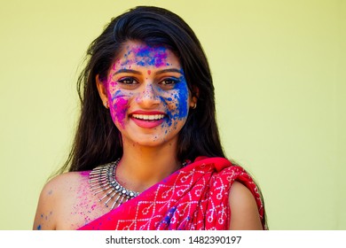 Holi Festival Of Colours. Portrait Of Happy Indian Girl In Traditional Hindu Sari On Holi Color . India Woman Silver Jewelry With Powder Paint On Dress ,colorful Pink And Blue Hair In Goa Kerala